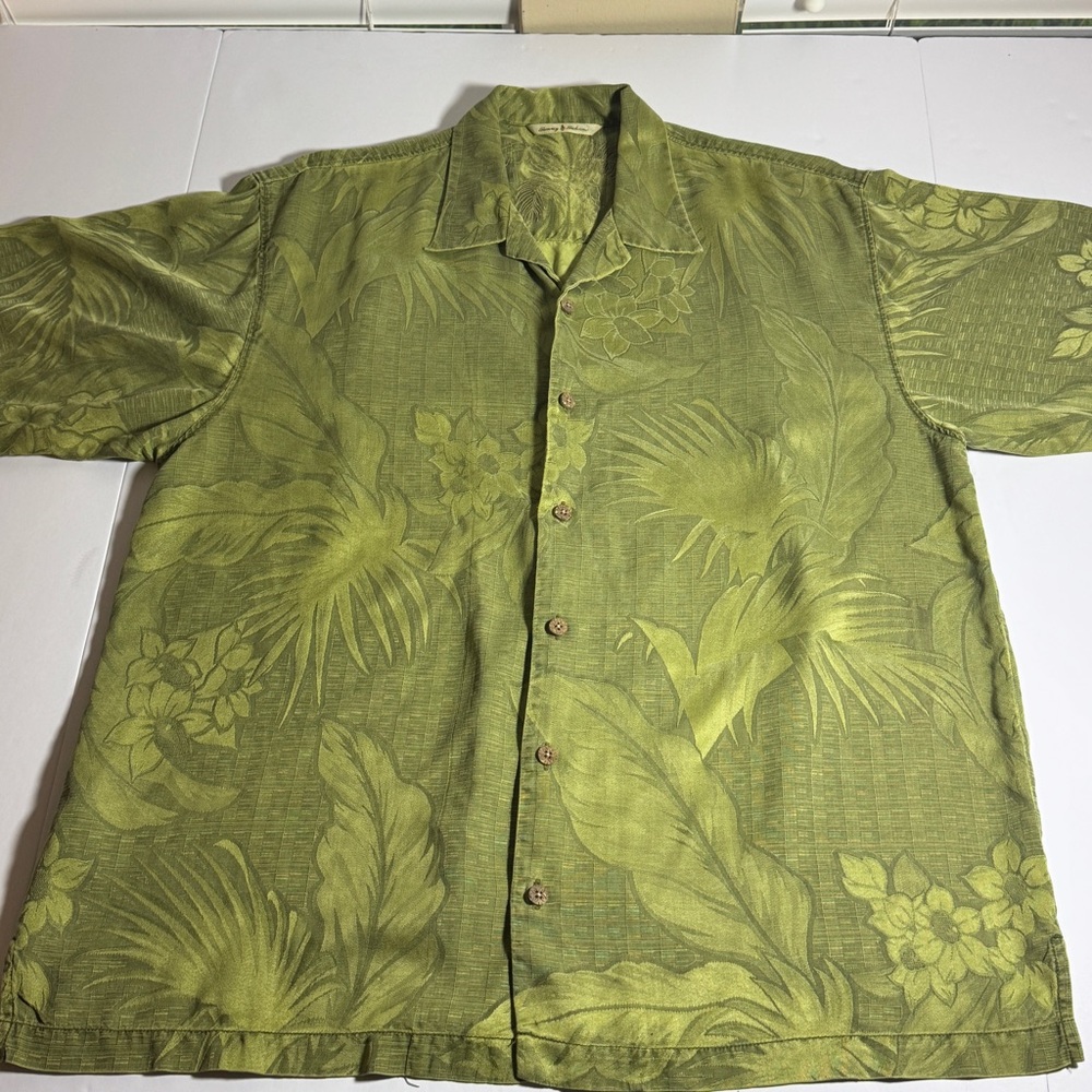 Tommy Bahama classic, green, silk, aloha dress shirt. Gives Hawaiian vibes.